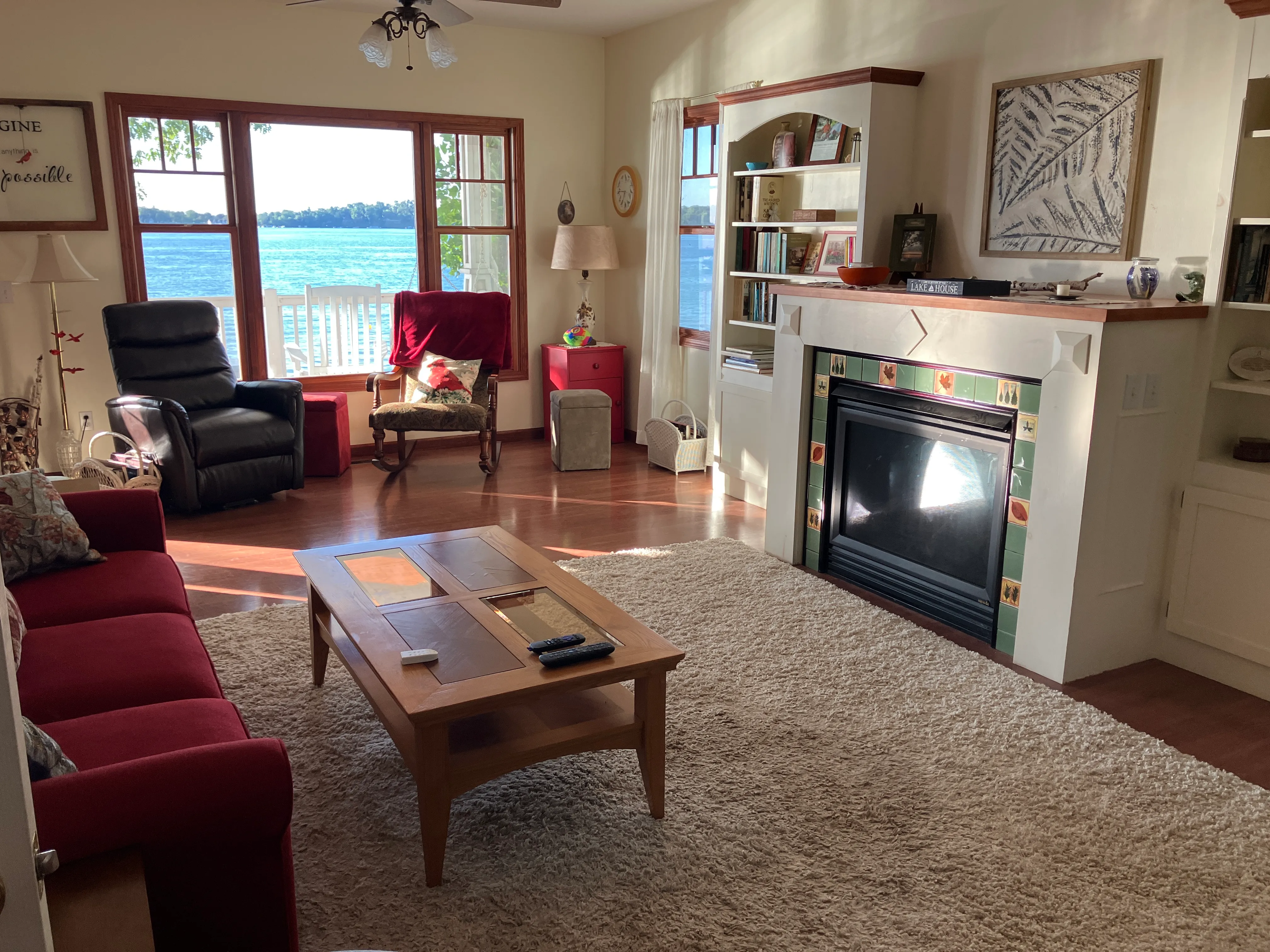 The open living room at Klinger Kastle, with comfortable seating arranged for conversation and lake views.